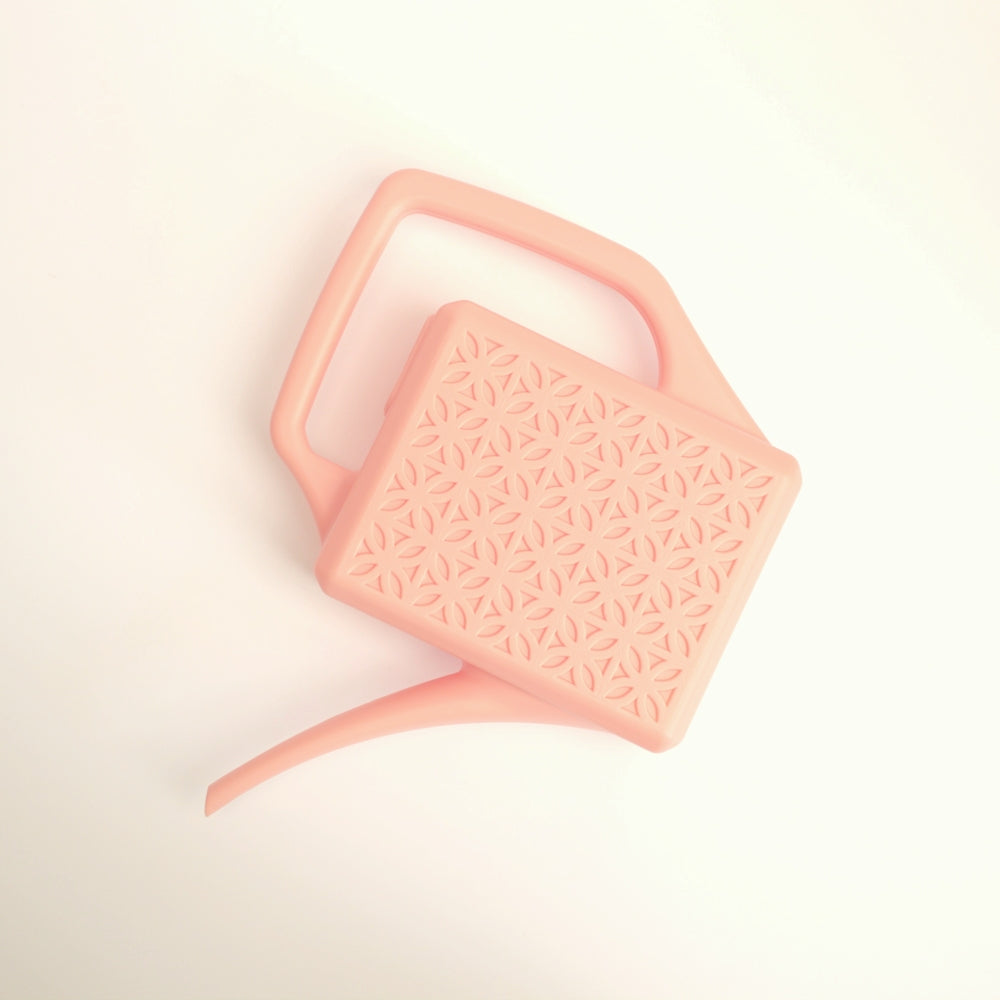 peach breeze block watering can